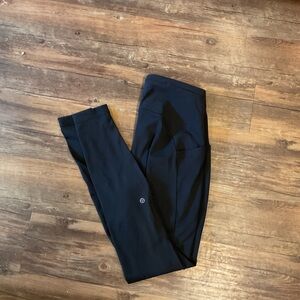 Size 8 Lululemon Fast and Free leggings with reflective detail